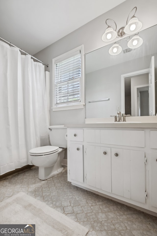 3220 Casteel Rd, Marietta, GA 30062 - bathroom featuring vanity, curtained shower, and tile patterned floors