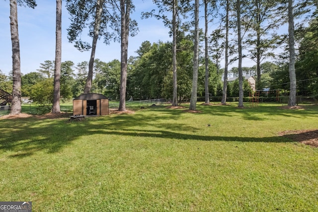 3220 Casteel Rd, Marietta, GA 30062 - view of yard featuring a shed and view of wooded area