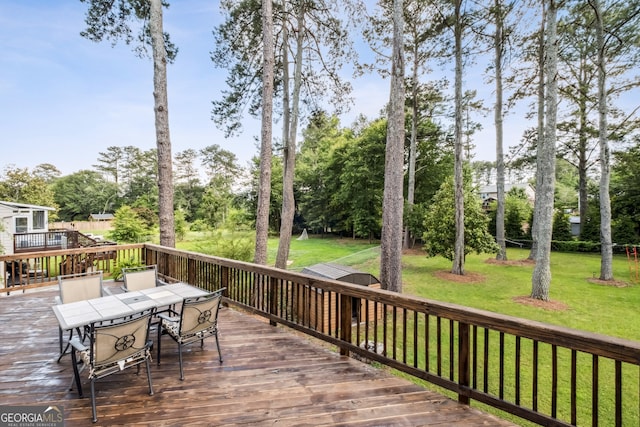 3220 Casteel Rd, Marietta, GA 30062 - deck featuring outdoor dining area, a yard, and view of scattered trees