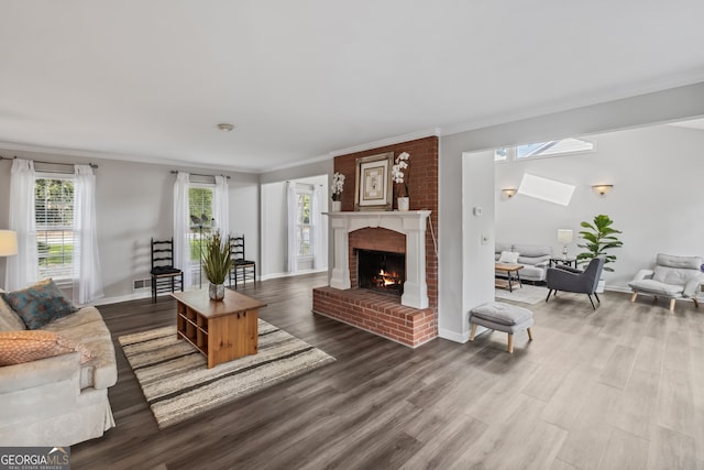 3220 Casteel Rd, Marietta, GA 30062 - living area with a skylight, crown molding, wood finished floors, and a brick fireplace
