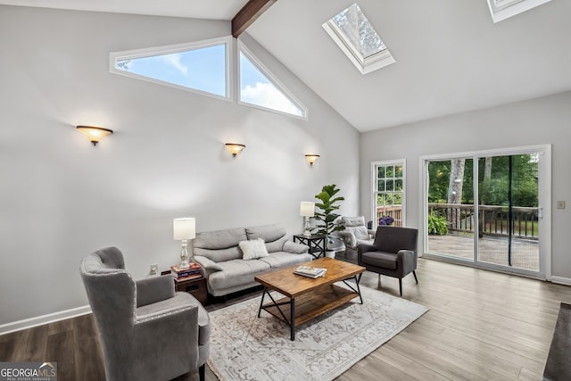 3220 Casteel Rd, Marietta, GA 30062 - living room with a skylight, high vaulted ceiling, healthy amount of natural light, beam ceiling, and wood finished floors