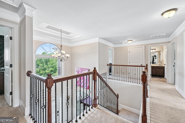 3024 Bridgehaven Ct, Snellville, GA 30039 - hall featuring an upstairs landing, light carpet, a chandelier, and ornamental molding
