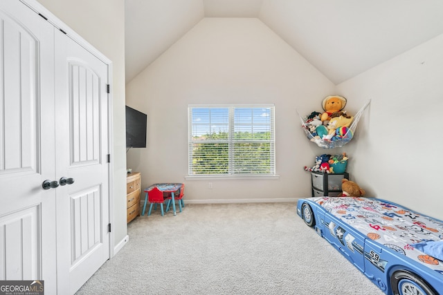 3024 Bridgehaven Ct, Snellville, GA 30039 - carpeted bedroom featuring vaulted ceiling and baseboards