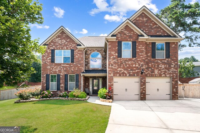 3024 Bridgehaven Ct, Snellville, GA 30039 - view of front of house featuring driveway, an attached garage, and brick siding