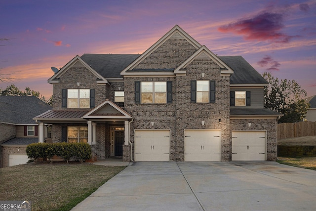 7691 Brazos Trl, Fairburn, GA 30213 - view of front of home featuring concrete driveway, an attached garage, brick siding, and covered porch