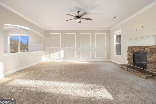 7691 Brazos Trl, Fairburn, GA 30213 - unfurnished living room with carpet floors, crown molding, a ceiling fan, and a fireplace