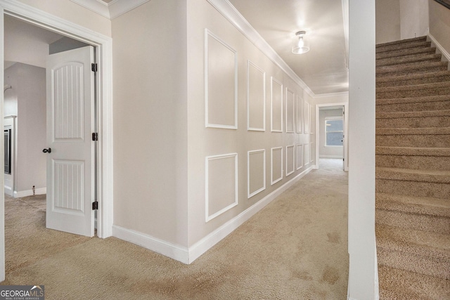 7691 Brazos Trl, Fairburn, GA 30213 - hall with carpet flooring, ornamental molding, and stairway