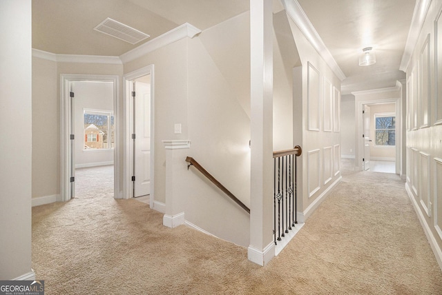 7691 Brazos Trl, Fairburn, GA 30213 - hall featuring an upstairs landing, light colored carpet, and crown molding