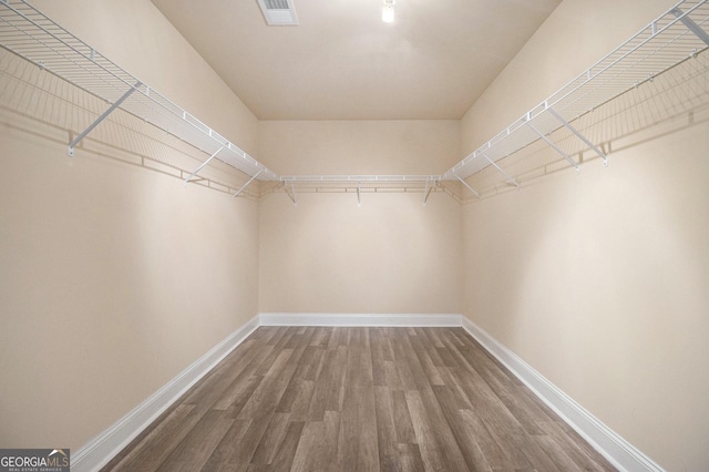 7691 Brazos Trl, Fairburn, GA 30213 - walk in closet with wood finished floors