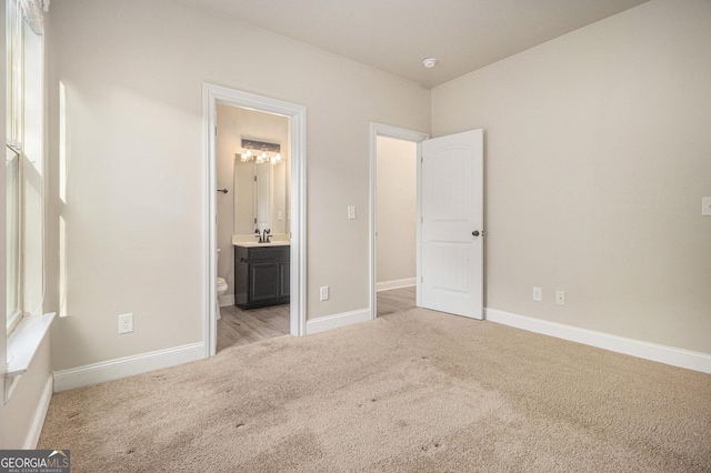 7691 Brazos Trl, Fairburn, GA 30213 - unfurnished bedroom featuring carpet flooring and connected bathroom