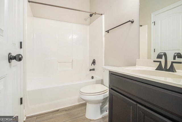 7691 Brazos Trl, Fairburn, GA 30213 - bathroom featuring vanity, bathtub / shower combination, and wood finished floors