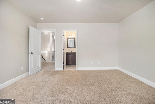 7691 Brazos Trl, Fairburn, GA 30213 - unfurnished bedroom with light carpet and ensuite bath