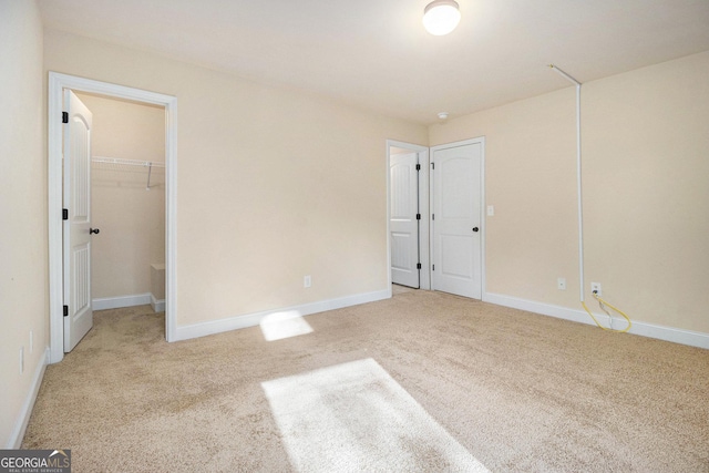 7691 Brazos Trl, Fairburn, GA 30213 - unfurnished bedroom with light carpet and a spacious closet