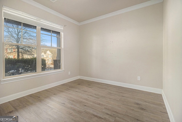 7691 Brazos Trl, Fairburn, GA 30213 - unfurnished room with ornamental molding and wood finished floors