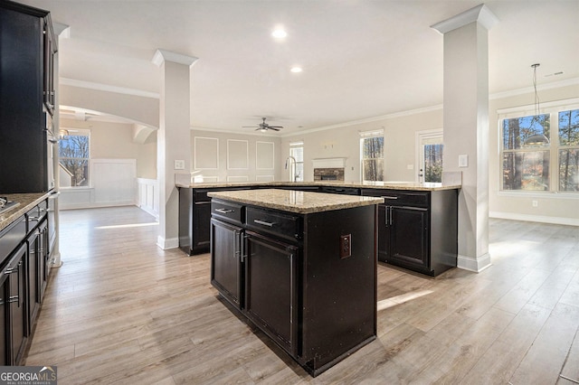 7691 Brazos Trl, Fairburn, GA 30213 - kitchen with ceiling fan, ornamental molding, light wood finished floors, healthy amount of natural light, and recessed lighting