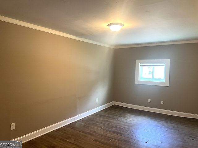 6300 Creekford Ln, Lithonia, GA 30058 - spare room with crown molding and dark wood-type flooring