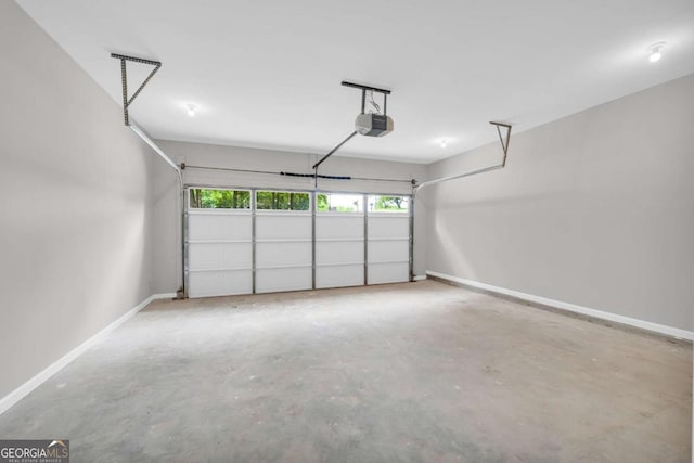 155 Carey St, Franklin Springs, GA 30662 - garage with a garage door opener and baseboards