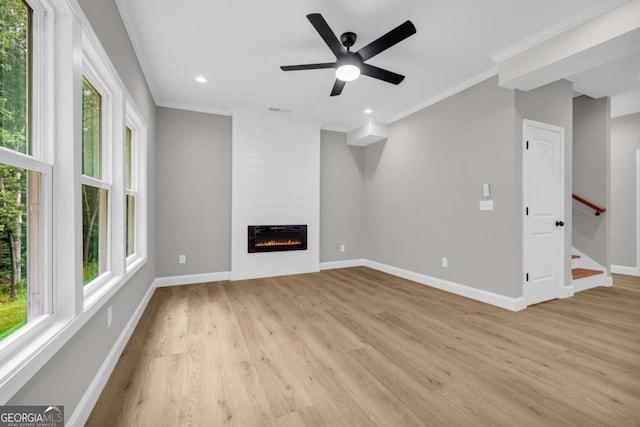 155 Carey St, Franklin Springs, GA 30662 - unfurnished living room with light wood finished floors, ornamental molding, a fireplace, ceiling fan, and recessed lighting