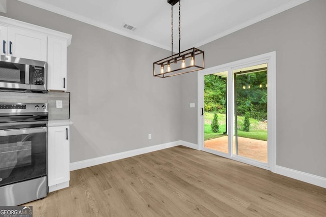 155 Carey St, Franklin Springs, GA 30662 - unfurnished dining area featuring ornamental molding, light wood-style floors, and a chandelier
