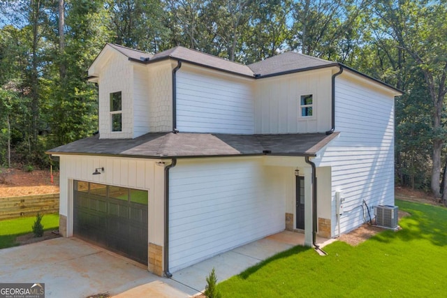155 Carey St, Franklin Springs, GA 30662 - view of front of home with a front lawn, board and batten siding, roof with shingles, and an attached garage