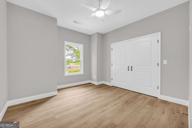 155 Carey St, Franklin Springs, GA 30662 - unfurnished bedroom featuring light wood-type flooring and a ceiling fan