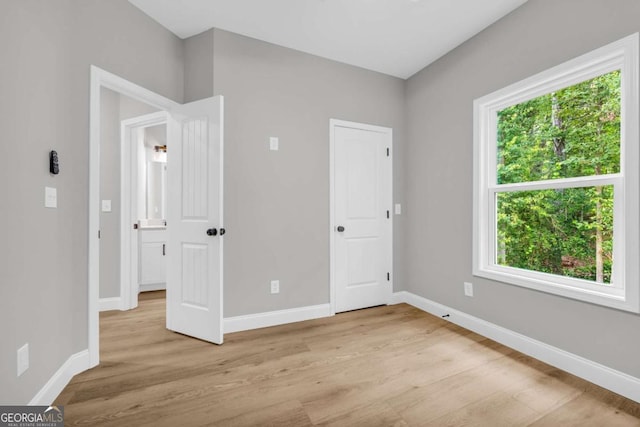 155 Carey St, Franklin Springs, GA 30662 - unfurnished bedroom with light wood-style flooring and baseboards