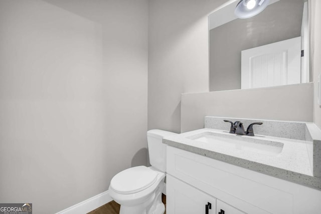 155 Carey St, Franklin Springs, GA 30662 - half bathroom featuring vanity and wood finished floors
