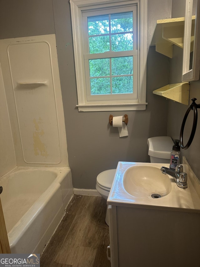 26 Fleming St, Royston, GA 30662 - full bath featuring wood finished floors, vanity, and shower / bath combination