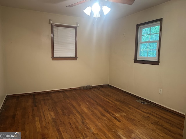 26 Fleming St, Royston, GA 30662 - unfurnished room featuring a ceiling fan and dark wood finished floors
