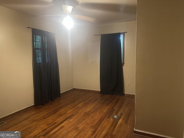 26 Fleming St, Royston, GA 30662 - spare room with dark wood-style floors and a ceiling fan