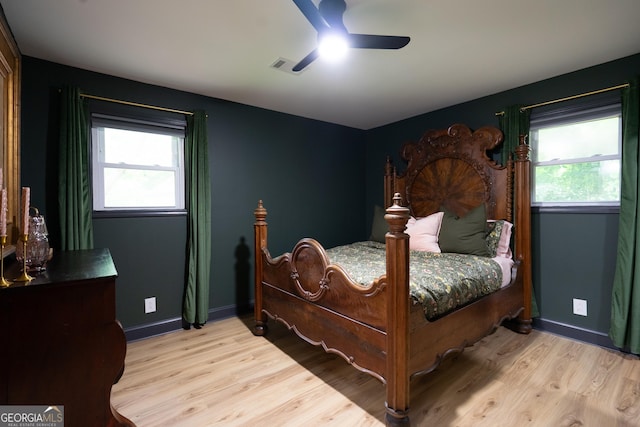 1120 Glass Bridge Rd, Lagrange, GA 30240 - bedroom featuring wood finished floors, multiple windows, and ceiling fan