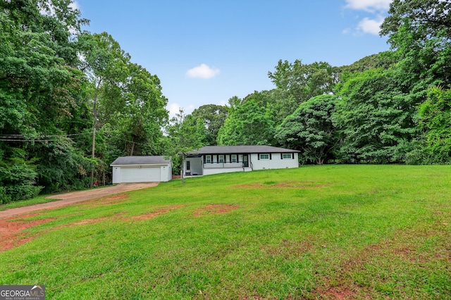 1120 Glass Bridge Rd, Lagrange, GA 30240 - ranch-style home featuring dirt driveway, a garage, a front yard, a view of trees, and an outbuilding