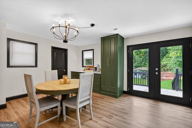 1120 Glass Bridge Rd, Lagrange, GA 30240 - dining space with light wood-type flooring, a chandelier, and french doors