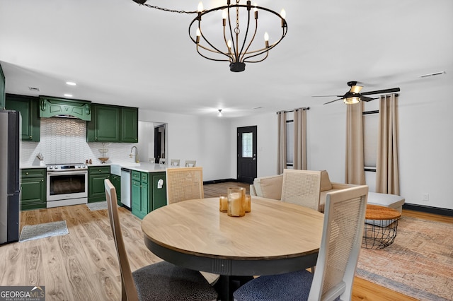 1120 Glass Bridge Rd, Lagrange, GA 30240 - dining area featuring a chandelier, light wood finished floors, and ceiling fan