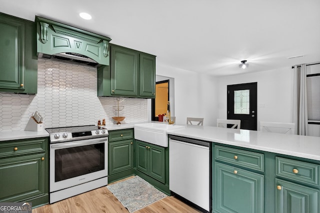 1120 Glass Bridge Rd, Lagrange, GA 30240 - kitchen with stainless steel electric range oven, dishwasher, tasteful backsplash, light wood finished floors, and green cabinets