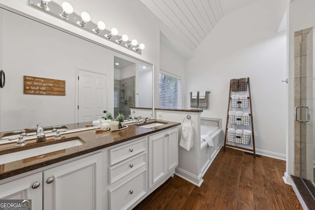 8485 Anchor On Lanier Ct, Gainesville, GA 30506 - full bathroom with vaulted ceiling, a stall shower, double vanity, hardwood / wood-style floors, and a bath