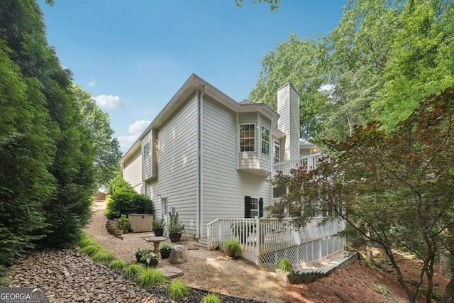 8485 Anchor On Lanier Ct, Gainesville, GA 30506 - view of side of property featuring a chimney and a balcony