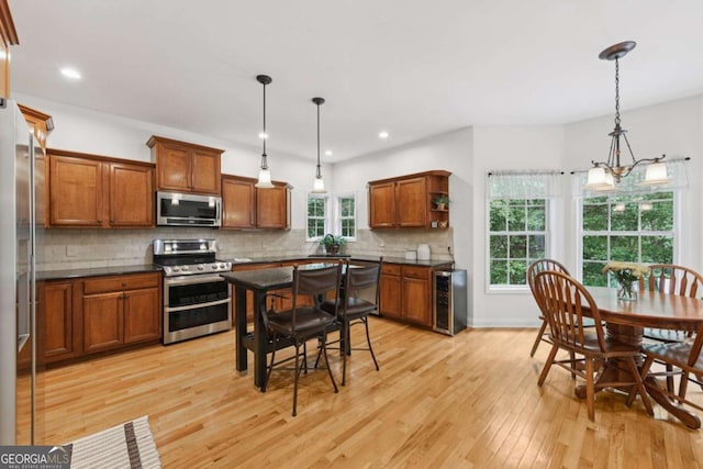 8485 Anchor On Lanier Ct, Gainesville, GA 30506 - kitchen with stainless steel appliances, wine cooler, dark countertops, open shelves, and recessed lighting
