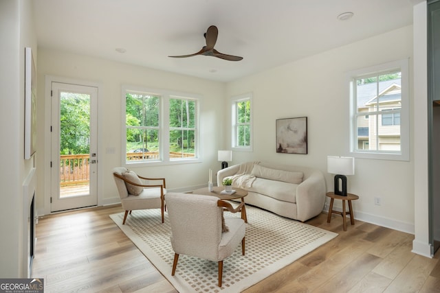 38 Mildred Pl NW, Atlanta, GA 30318 - living room featuring ceiling fan and light wood-style flooring