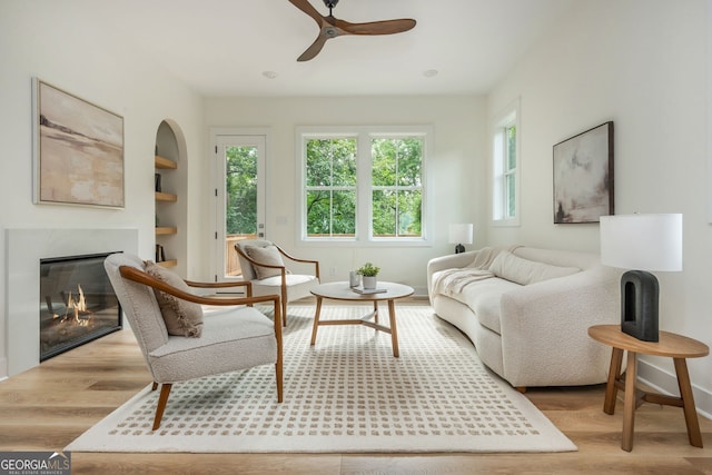 38 Mildred Pl NW, Atlanta, GA 30318 - living room featuring ceiling fan, wood finished floors, a high end fireplace, and built in features