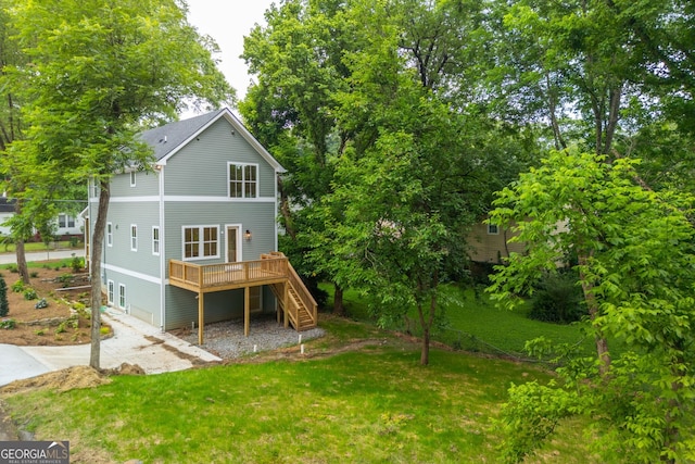 38 Mildred Pl NW, Atlanta, GA 30318 - back of property with stairway, a deck, and a yard