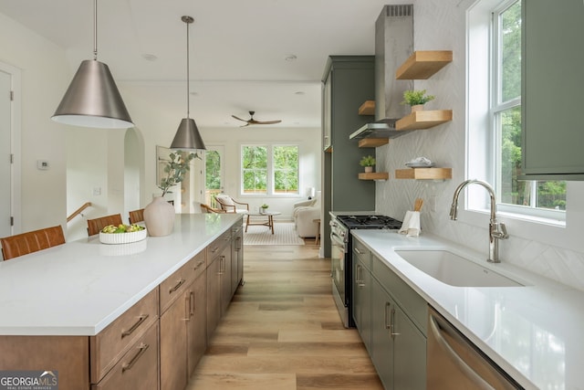 38 Mildred Pl NW, Atlanta, GA 30318 - kitchen featuring open shelves, stainless steel appliances, light wood-type flooring, wall chimney range hood, and light countertops