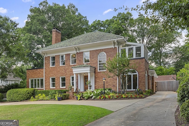 1036 Oxford Rd NE, Atlanta, GA 30306 - view of front of house featuring concrete driveway, a chimney, and brick siding