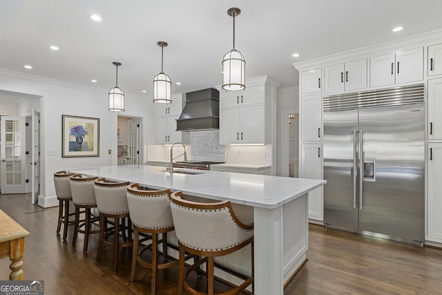 1036 Oxford Rd NE, Atlanta, GA 30306 - kitchen featuring built in fridge, custom exhaust hood, recessed lighting, backsplash, and white cabinets