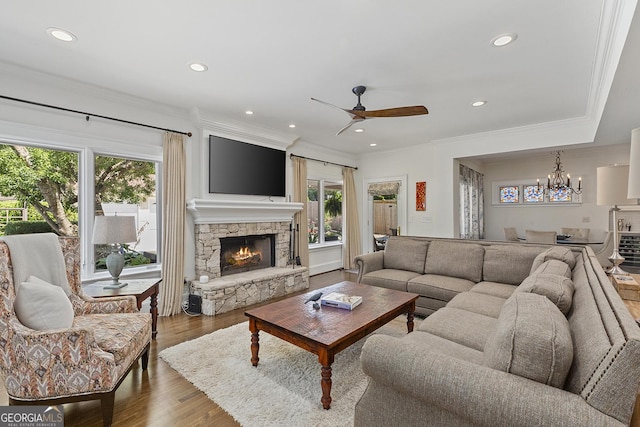 1036 Oxford Rd NE, Atlanta, GA 30306 - living room featuring healthy amount of natural light, a ceiling fan, a fireplace, ornamental molding, and recessed lighting