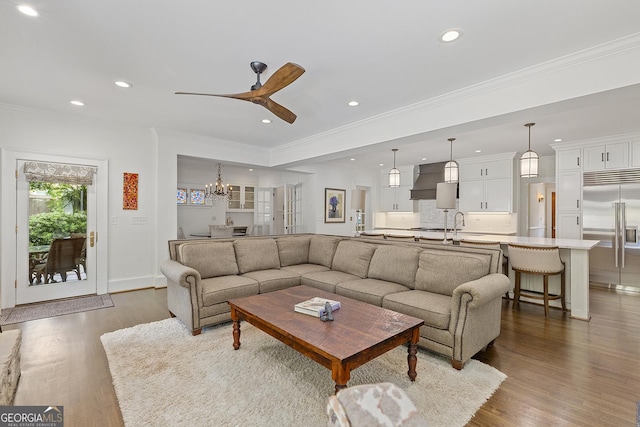 1036 Oxford Rd NE, Atlanta, GA 30306 - living room with recessed lighting, dark wood-style flooring, a ceiling fan, a chandelier, and ornamental molding