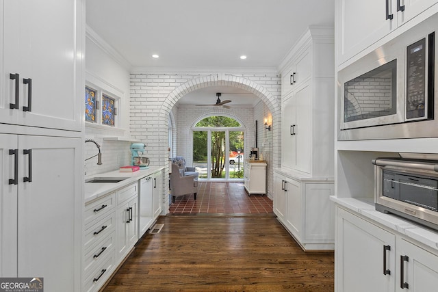 1036 Oxford Rd NE, Atlanta, GA 30306 - kitchen featuring built in microwave, ceiling fan, dark wood-style flooring, white cabinets, and light countertops