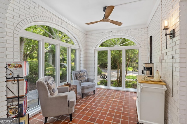 1036 Oxford Rd NE, Atlanta, GA 30306 - sunroom featuring ornamental molding, brick wall, tile patterned flooring, and a wood stove