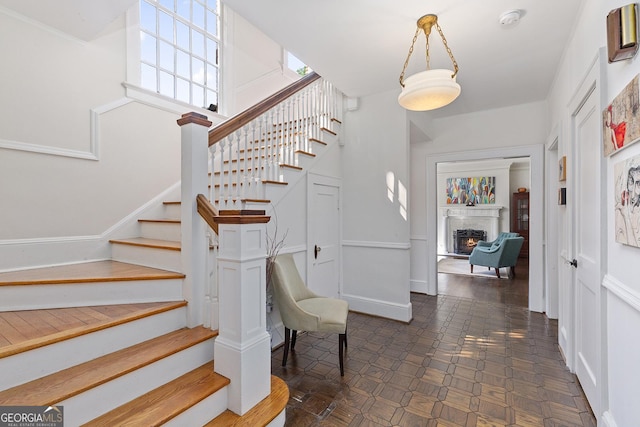 1036 Oxford Rd NE, Atlanta, GA 30306 - foyer entrance with stairs and a lit fireplace