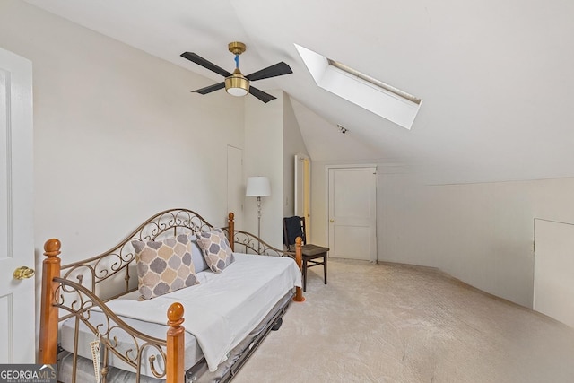 1036 Oxford Rd NE, Atlanta, GA 30306 - bedroom featuring a skylight, vaulted ceiling, light carpet, and ceiling fan
